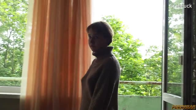 Passionate caresses and intimacy of a young Moscow couple in a small studio apartment